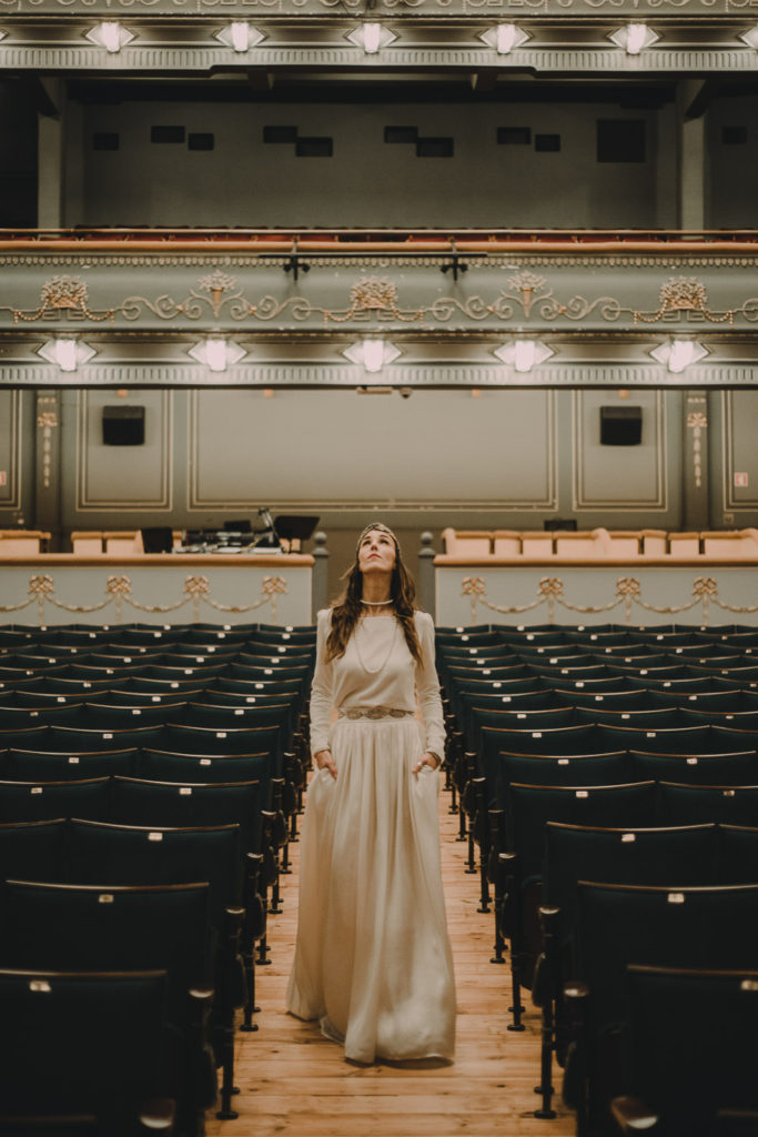 bride walking on sidewalk theatre - brides inspiration wedding photographer