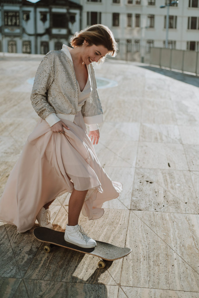 Joana laughing in her pink sparkling dress - brides inspiration wedding photographer