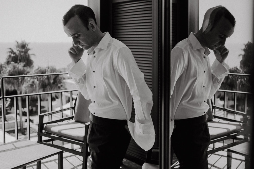 destination wedding cascais - groom at balcony