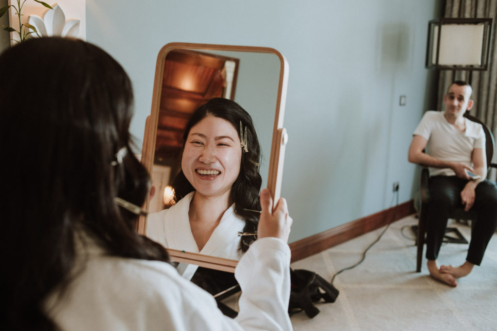 destination wedding cascais - bride smiling looking at mirror