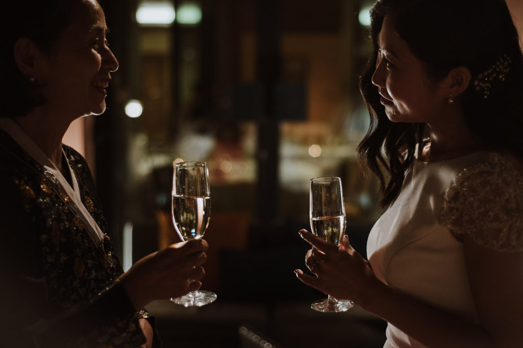 destination wedding cascais - bride and mother drinking champagne
