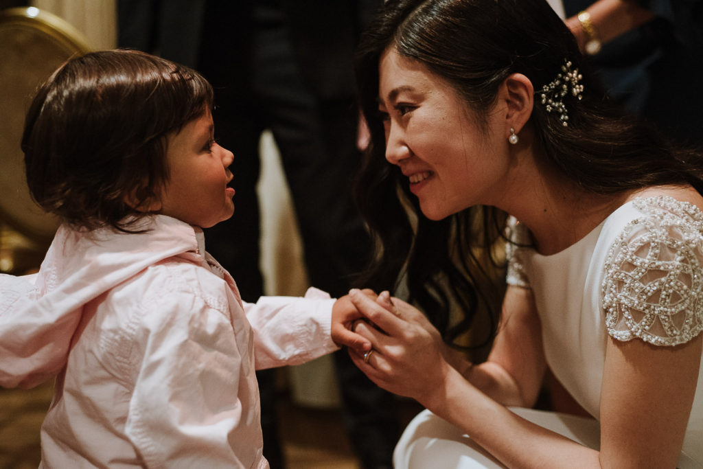destination wedding cascais - bride and child talking