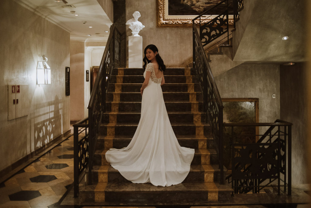 destination wedding cascais - bride at staircase of hotel