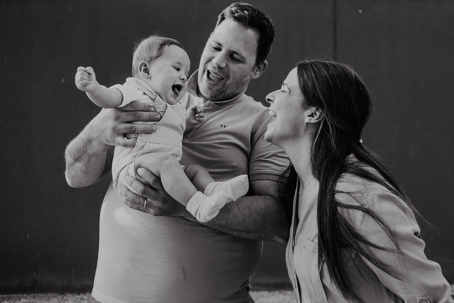 couple and baby laughing - family wedding photographer portugal