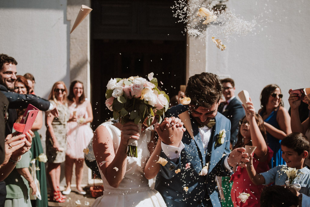 couple leaving church casa de reguengos wedding photographer